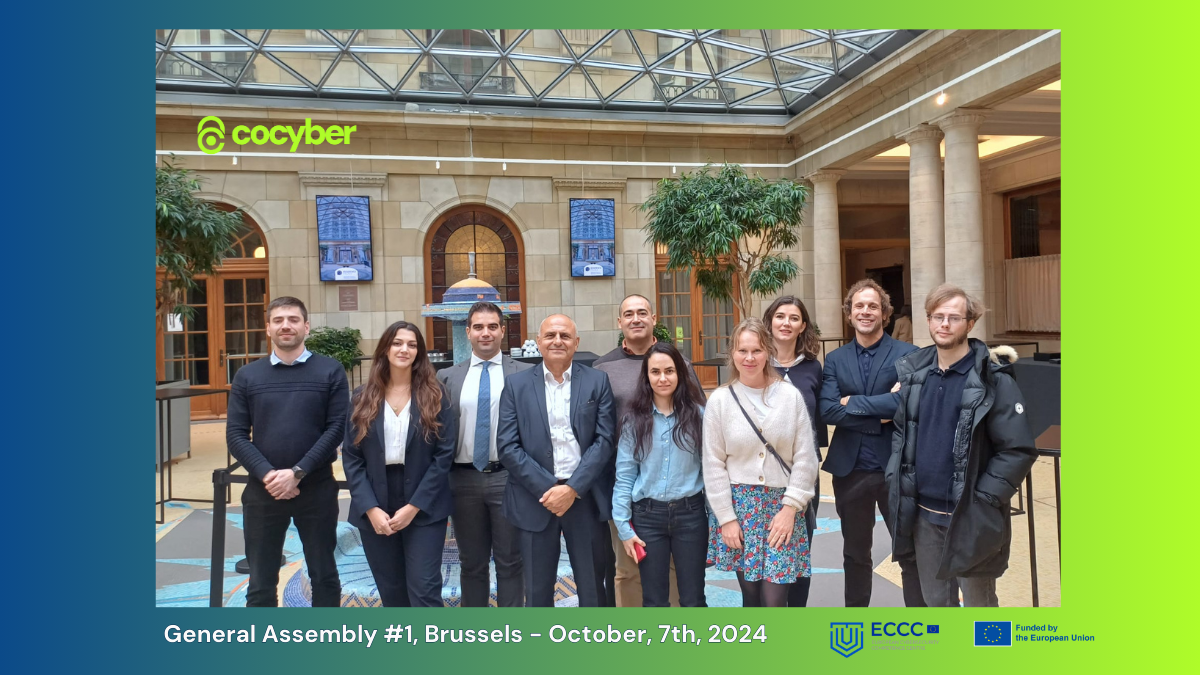 Group photo of nine people at an indoor event with classical architecture, branded with CoCyber and EU project logos